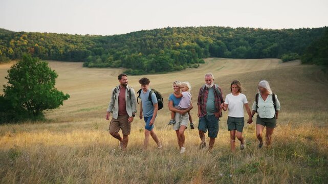 Family relaxing and spending time together at campsite.