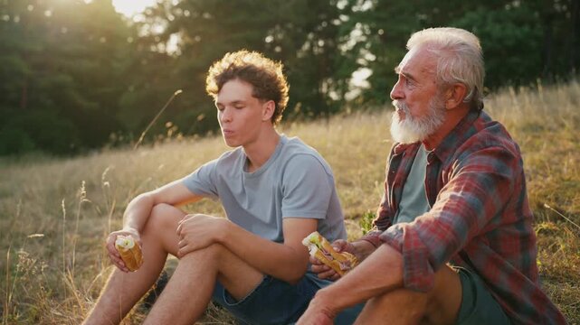 Family relaxing and spending time together at campsite.