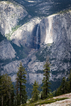 Panoramic view of Yosemite Falls cascading down granite cliffs in Yosemite National Park