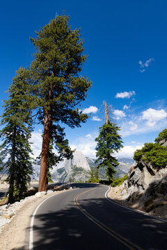 Winding Glacier Point Road with scenic view of Half Dome in Yosemite National Park California