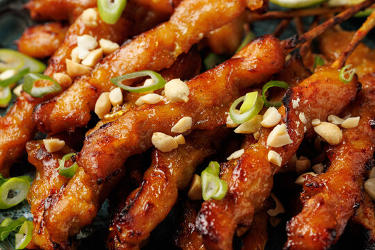 Grilled Chicken Satay Skewers with Peanuts, Spring Onions and Lime