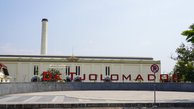 De Tjolomadoe historic former sugar factory turned cultural heritage landmark in Karanganyar, Central Java, Indonesia, featuring iconic chimney, red lettering sign, and colonial architecture.