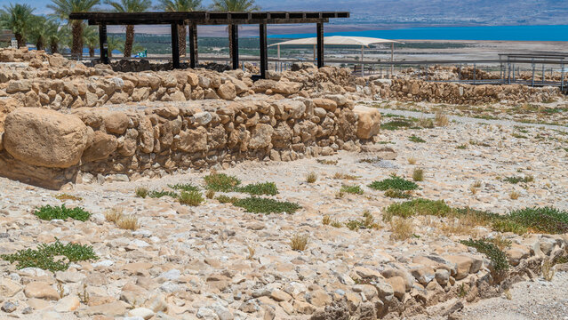 View of the ruins at Qumran National Park and the Dead Sea behind.
