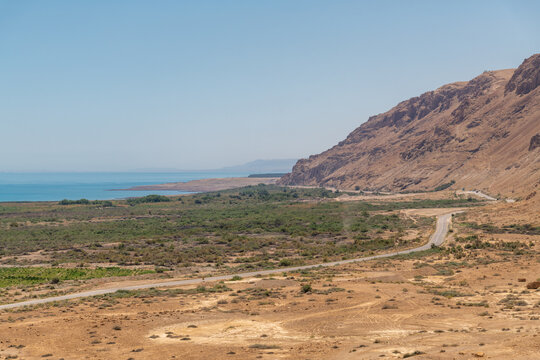 View of the mountains, highway and Dead Sea from Qumran National Park in Israel.
