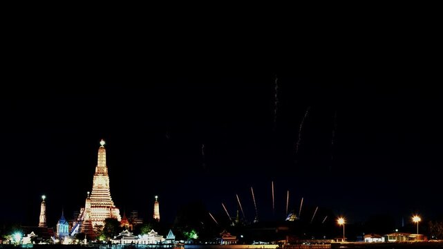 Amazing beautiful colorful firework display over Wat Arun, Bangkok, Thailand on celebration night. Fireworks show for happy new year, 4k footage.	