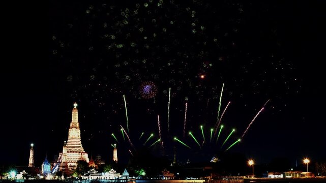 Amazing beautiful colorful firework display over Wat Arun, Bangkok, Thailand on celebration night. Fireworks show for happy new year, 4k footage.	