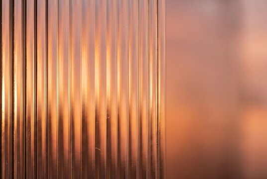 Ribbed glass texture with blurred warm sunset light