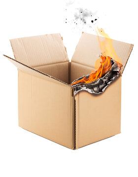 Open brown corrugated cardboard box catching fire with flames isolated on transparent background