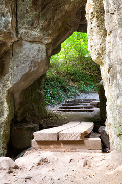 Huel Lee or Hohllay on Mullerthal hiking trail in Luxembourg, open cave with view to forest, sandstone rock formation