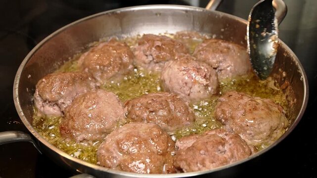 frying raw homemade minced meatballs in hot oil