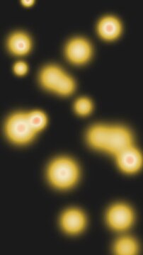 Glowing christmas bokeh lights floating on dark festive background