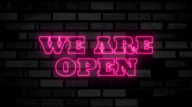 Bright pink neon we are open sign glows against a brick wall, ideal for caf promotions, storefront branding, and nightlife marketing.