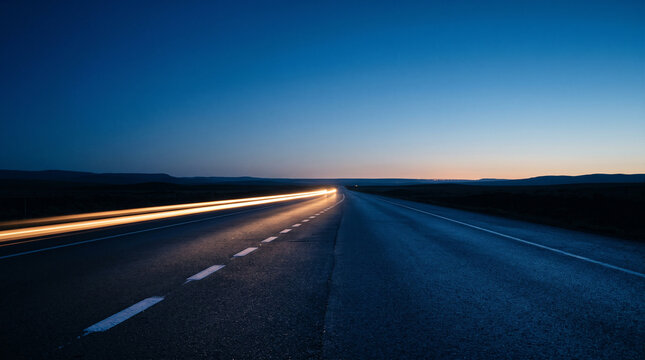 Minimalist Single Amber Light Streak on Empty Highway at Blue Hour With Vast Copy Space