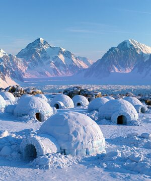Many snow shelters stand in a frozen landscape with snowy mountains in the background.