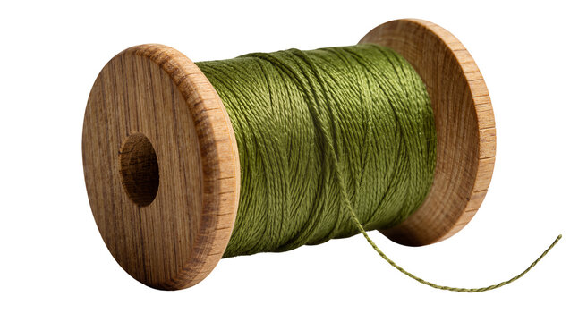 Wooden spool with wound green thread, isolated on transparent background