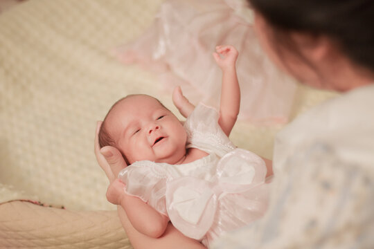 Maternal love, bonding, intimacy and family tenderness. Close up of a mother gazing affectionately at her newborn baby, highlighting their face to face connection in soft natural light.