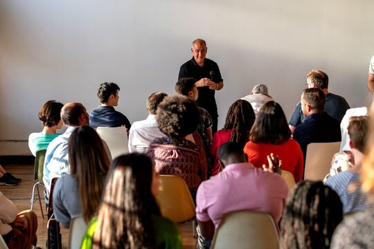 Diverse audience attending engaging seminar.