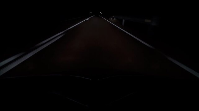 Night Drive POV Along Empty Two Lane Highway