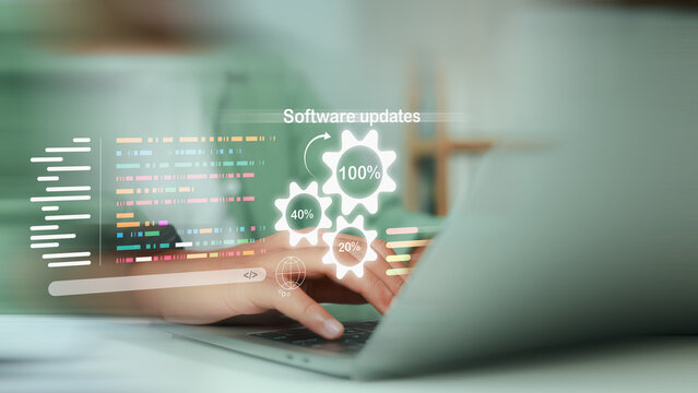 Developer typing on laptop with software updates progress icons. gear gears. and coding script display. representing system upgrade. application patch. and IT maintenance.