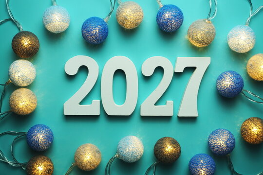 Happy New Year 2027 alphabet letter with cotton ball LED decoration on blue background