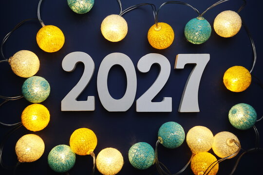 Happy New Year 2027 alphabet letter with cotton ball LED decoration on blue background