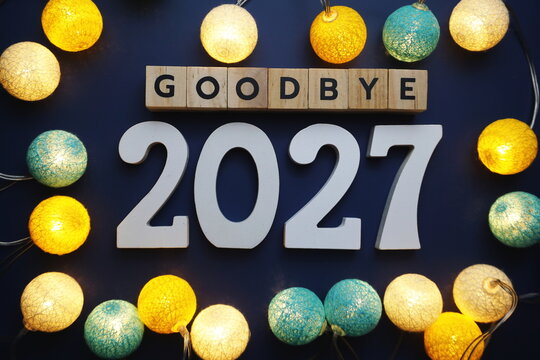 Goodbye 2027 alphabet letter with cotton ball LED decoration on blue background