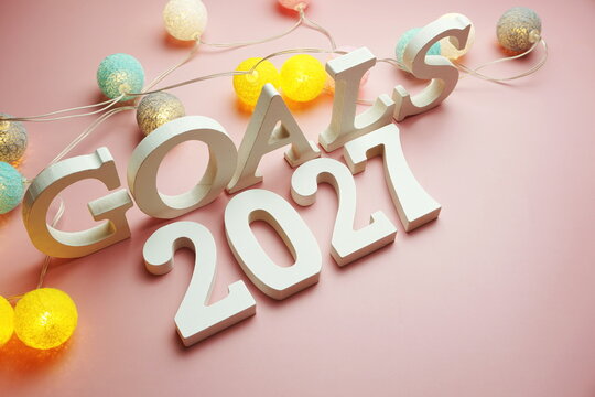 Golas 2027 alphabet letter with cotton ball LED decoration on pink background