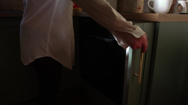 Hand opening kitchen cupboard cabinet door