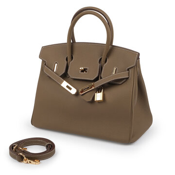 aupe structured womens handbag with textured leather, gold tone hardware, decorative padlock and detachable shoulder strap photographed at a three quarter angle on white.