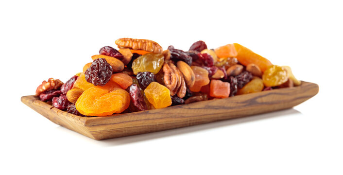 Assorted nuts and dried fruits isolated on a white background.