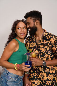 Joyful couple sharing a romantic moment together at home in bright summer style