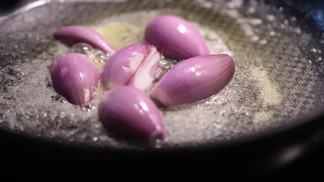 Stockholm, Sweden Shallot onions frying in a pan with butter. 