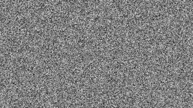 Abstract television static white noise and fuzzy grain pattern displaying signal interference on screen during analog broadcast transmission