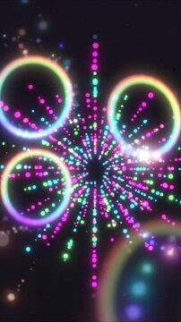 Glowing neon rings floating through colorful particle tunnel in hypnotic seamless motion graphics animation backdrop