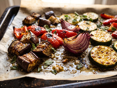 Sheet Pan With Baked Summer Vegetables On Parchment