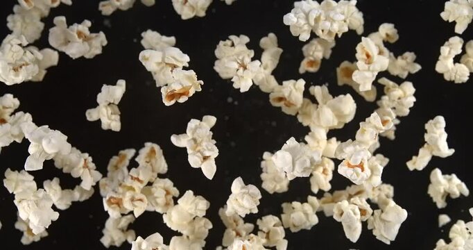Popcorn falling in slow motion 1000 fps on red background