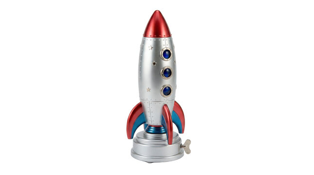 Rocket music box, playful space rocket-shaped musical ornament with a tall silver cylindrical rocket body, pointed upper nose cone, small circular portholes, three broad sculpted lower fins and a