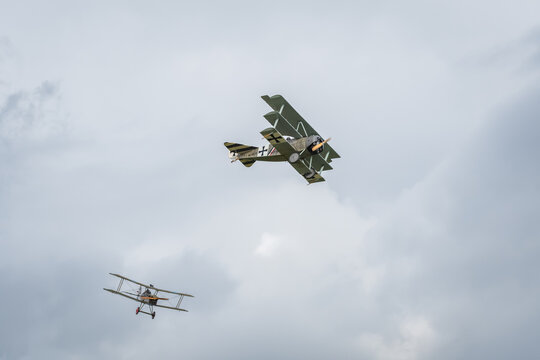 Szymanow, Poland - September, 5, 2026: Wroclaw Air Picnic, Fokker Dr.I triplane German fighter and Factory S.E.5 British fighter, planes from the First World War period in the air during the air show.