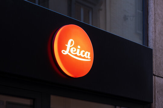 Illuminated photography store sign on a storefront in rome, italy