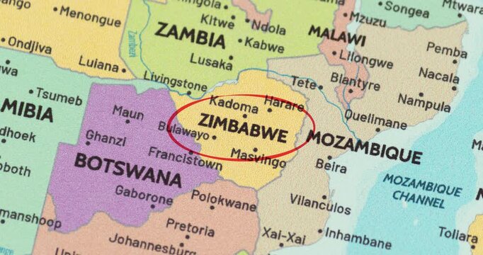 Detailed view of a red circle marking to zimbabwe on a modern political world map