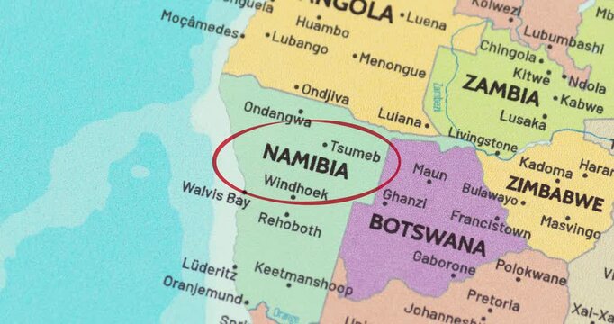 Detailed view of a red circle marking to namibia on a modern political world map