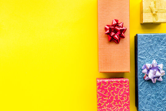 Wrapped gifts for boxing day 2018 pattern on yellow background top view copyspace