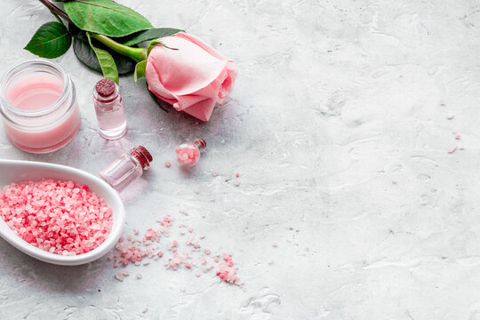 Natural organic cosmetics with rose oil. Cream, lotion, spa salt on white background copyspace