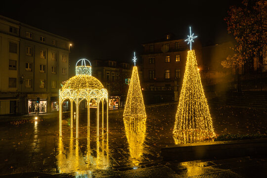 Christmas Light Arch beside a Church at Night