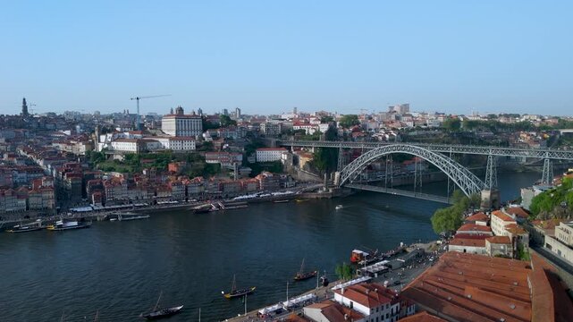 An aerial shot of Dom Lu&iacute;s I Bridge Above Porto's Douro River and Rooftops