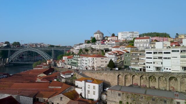 An aerial shot of Porto's Historic Rooftops and Dom Lu&iacute;s I Bridge from Above