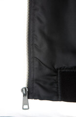 Metal zipper puller on black fabric © solidmaks