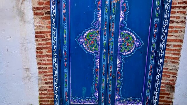 Ornate traditional blue door in Chefchaouen, Morocco