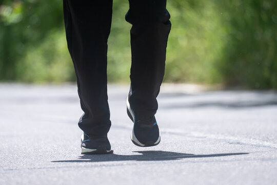 A man running along the road