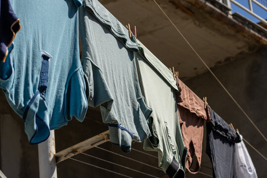 Clothes are drying outside on a clothesline.